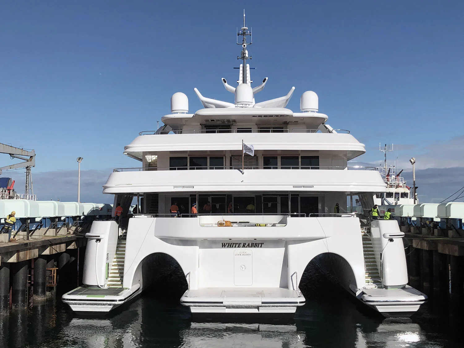 White Rabbit, the world's largest trimaran, featuring custom gold PVD-coated yacht lettering on the Stern.