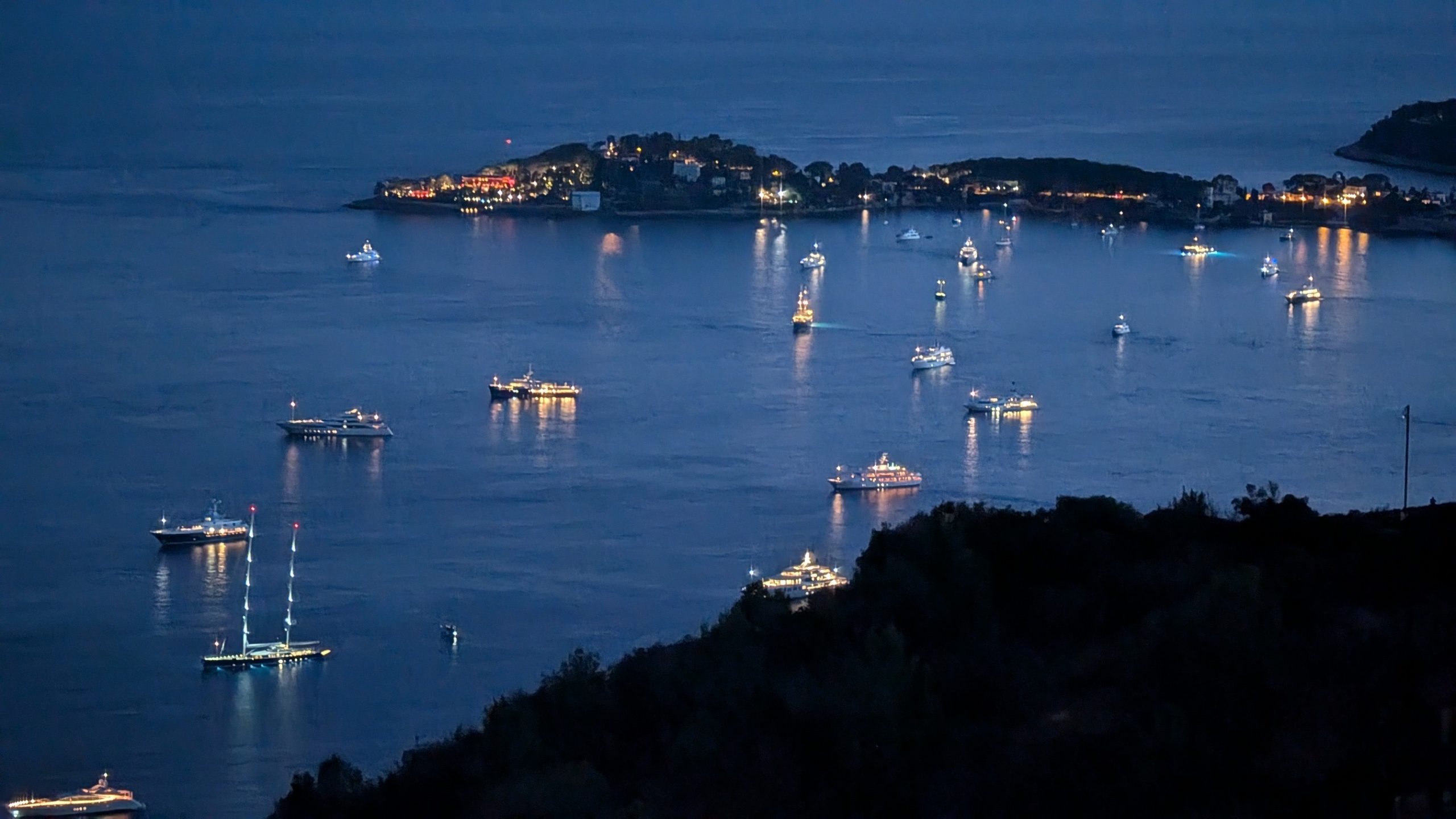 Lumenautica image of Superyachts at night in a harbour