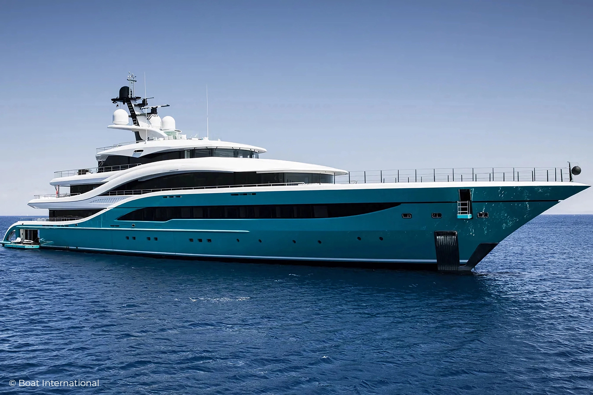 Yacht Go from Feadship and its bold aquamarine hull. Private Yacht No Boarding Sign from Lumenautica.