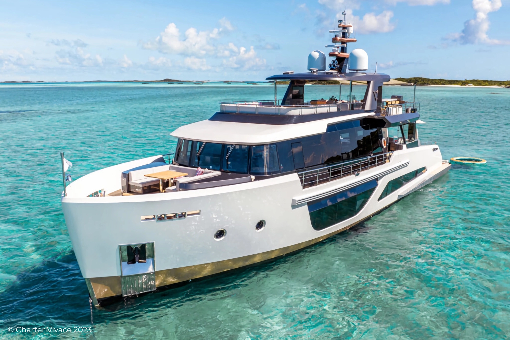 Superyacht M/Y Vivace in day light with a gold hull, Illuminated Yacht Sign from Lumenautica.